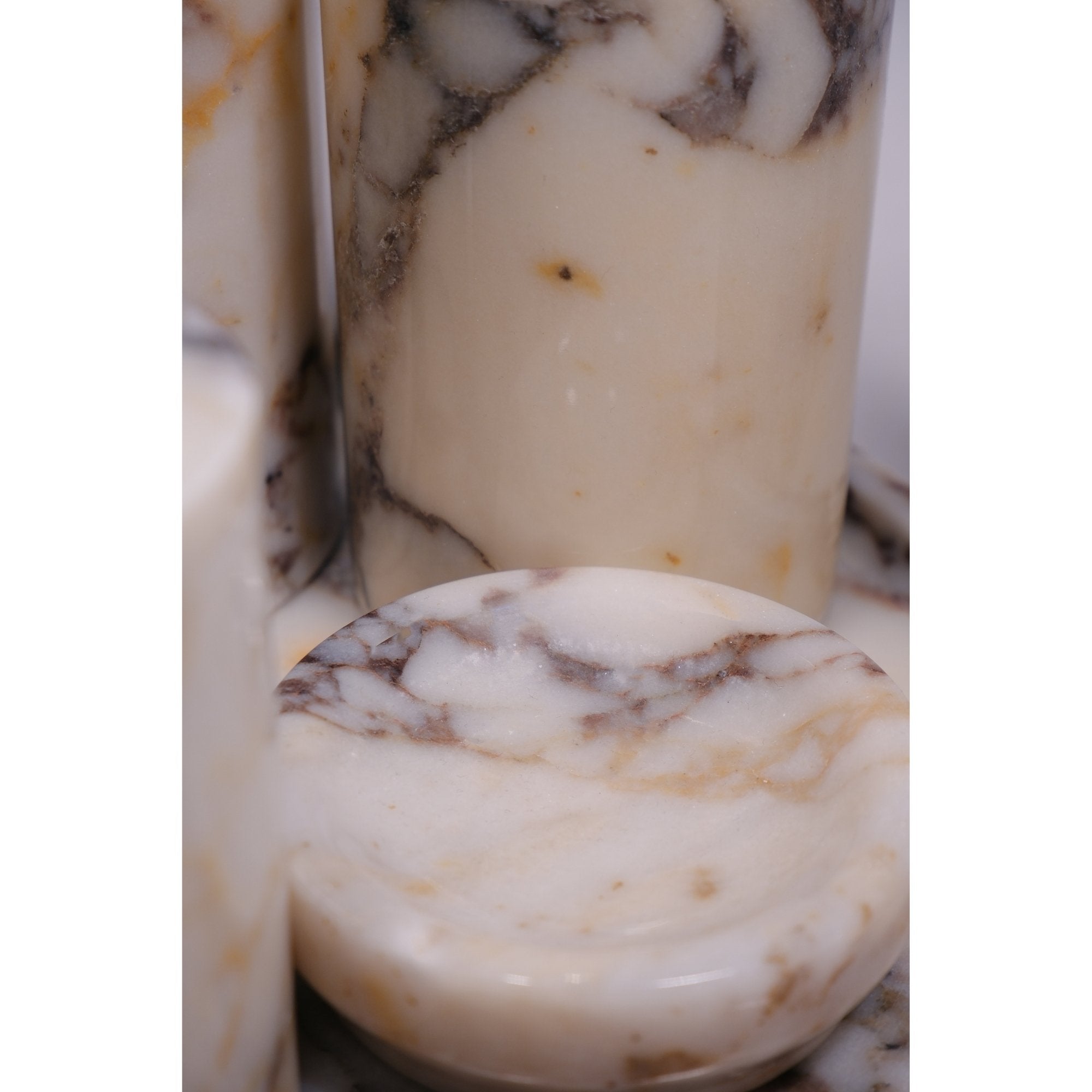 “Close-up of natural marble veining and polished gold detail on Petra Vera bathroom set”