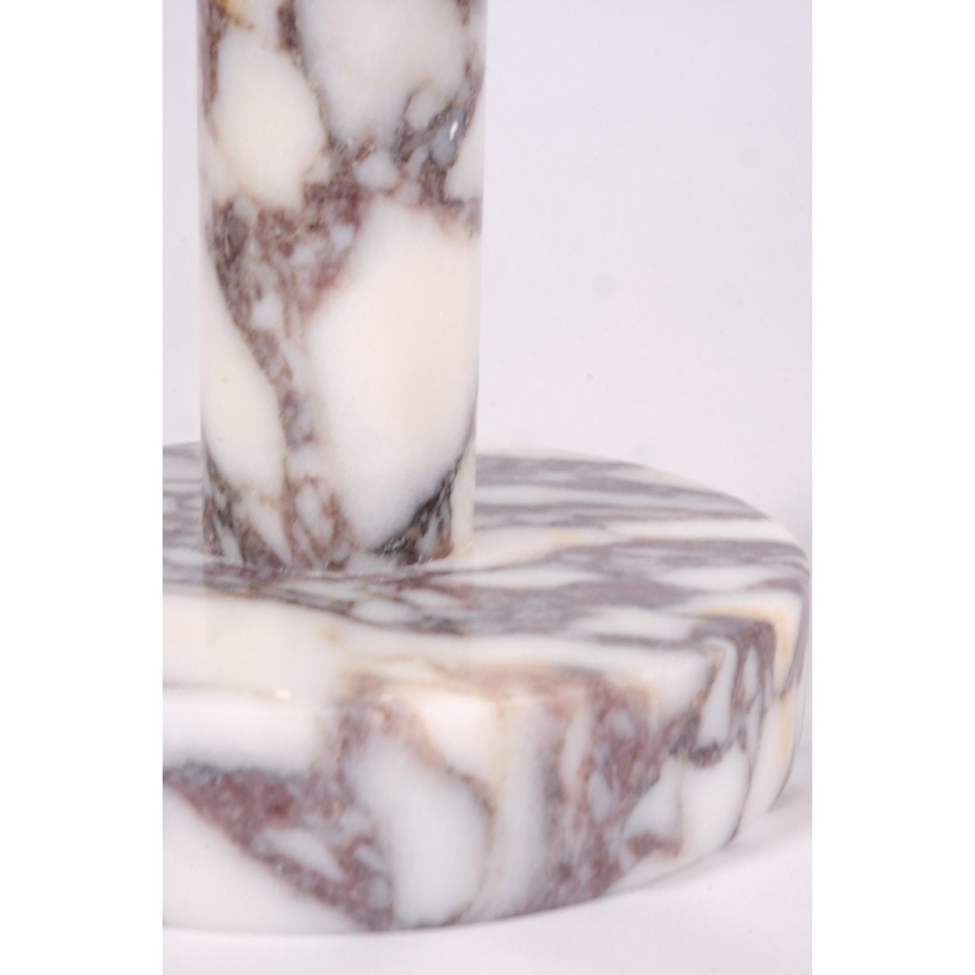 Close-up of marble paper towel holder showing smooth finish and violet veining