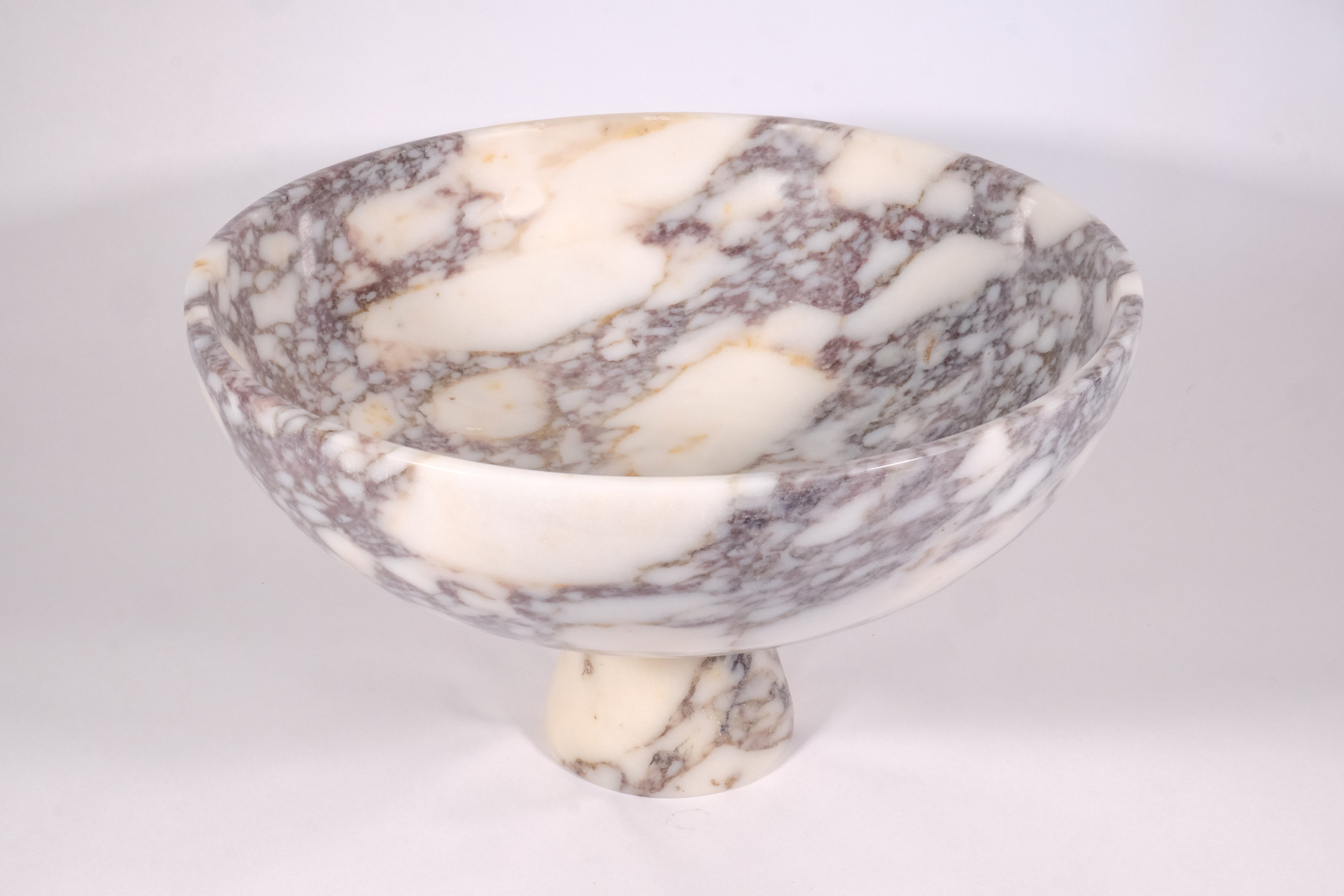 Handmade Calacatta Viola marble pedestal bowl with soft white surface and natural veining