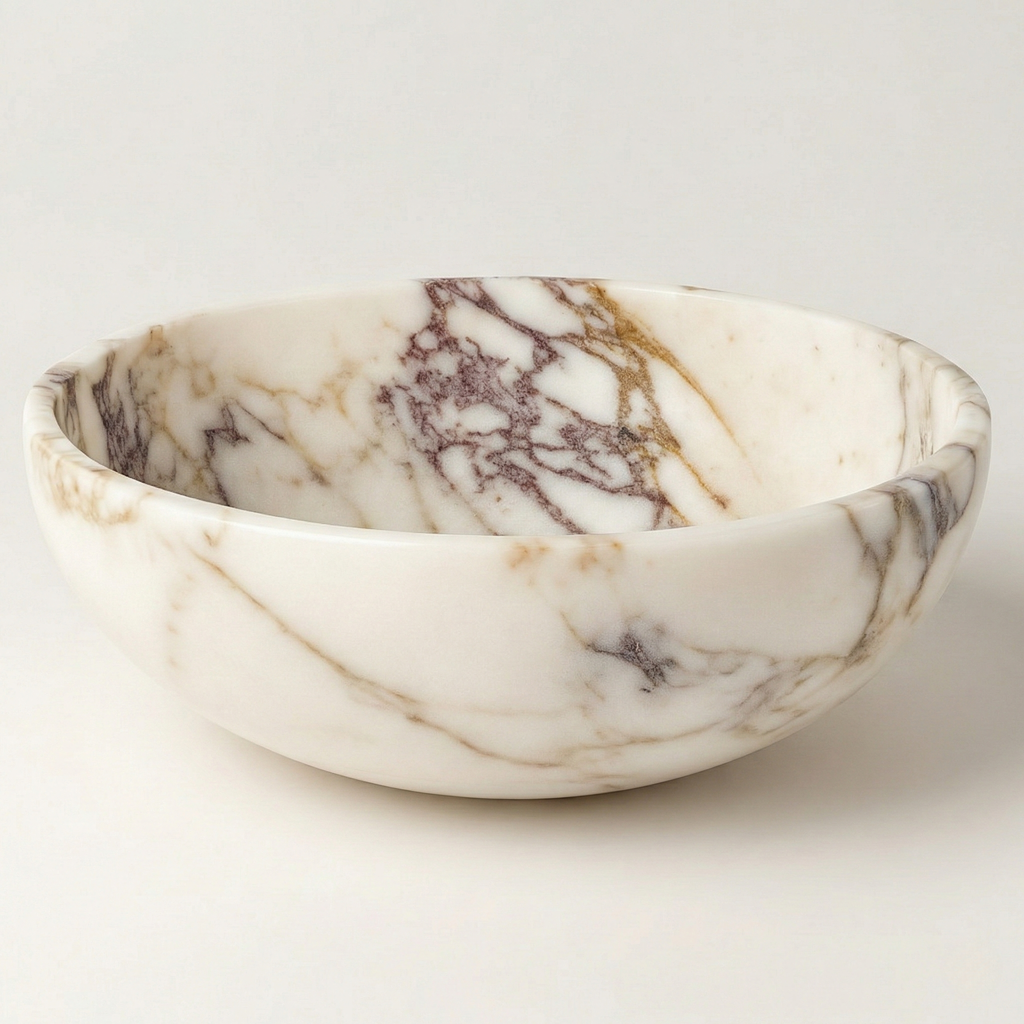 Large Calacatta Viola marble serving bowl on a clean white background, showcasing natural beige and purple veins with elegant craftsmanship.