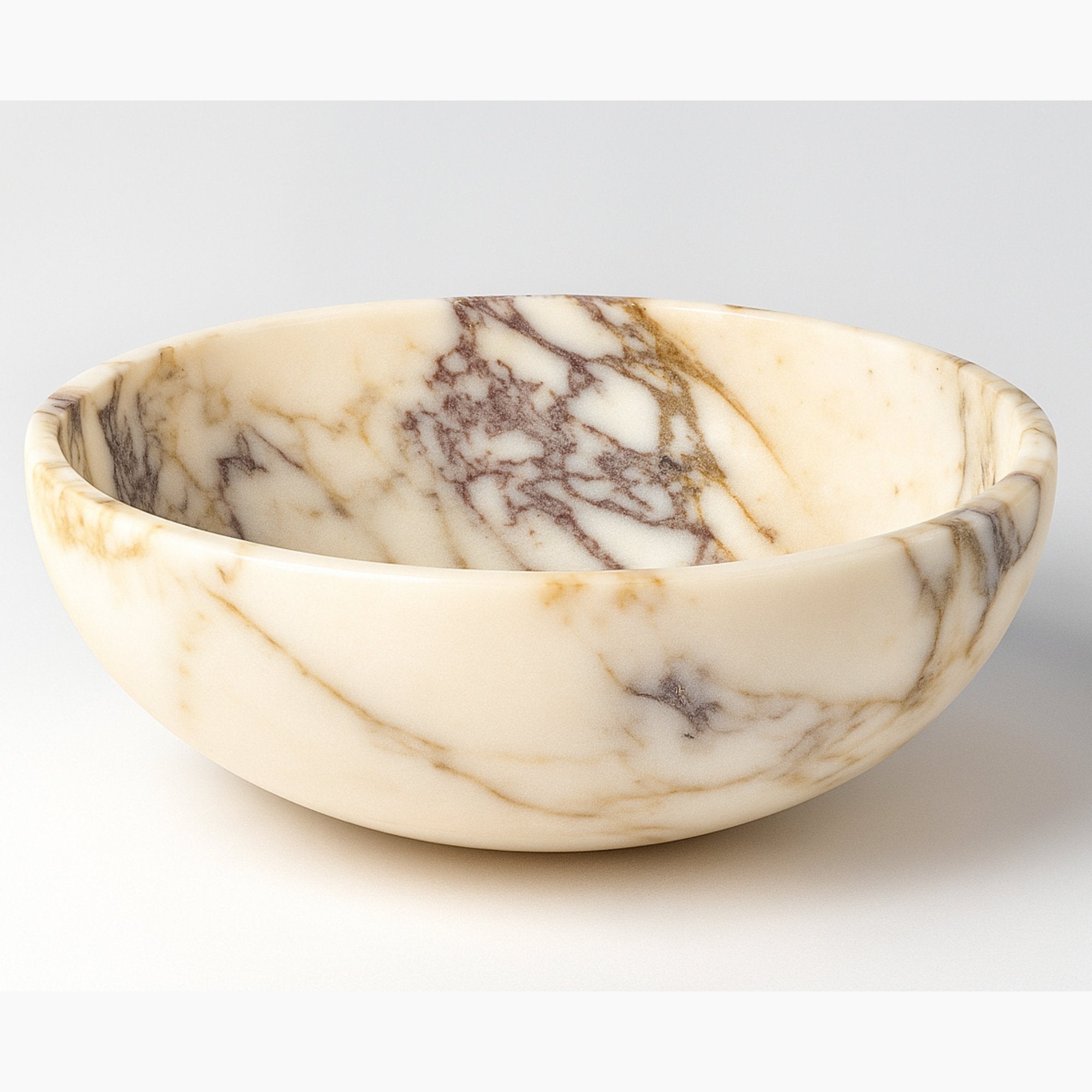 Large Calacatta Viola marble serving bowl on a clean white background, showcasing natural beige and purple veins with elegant craftsmanship.