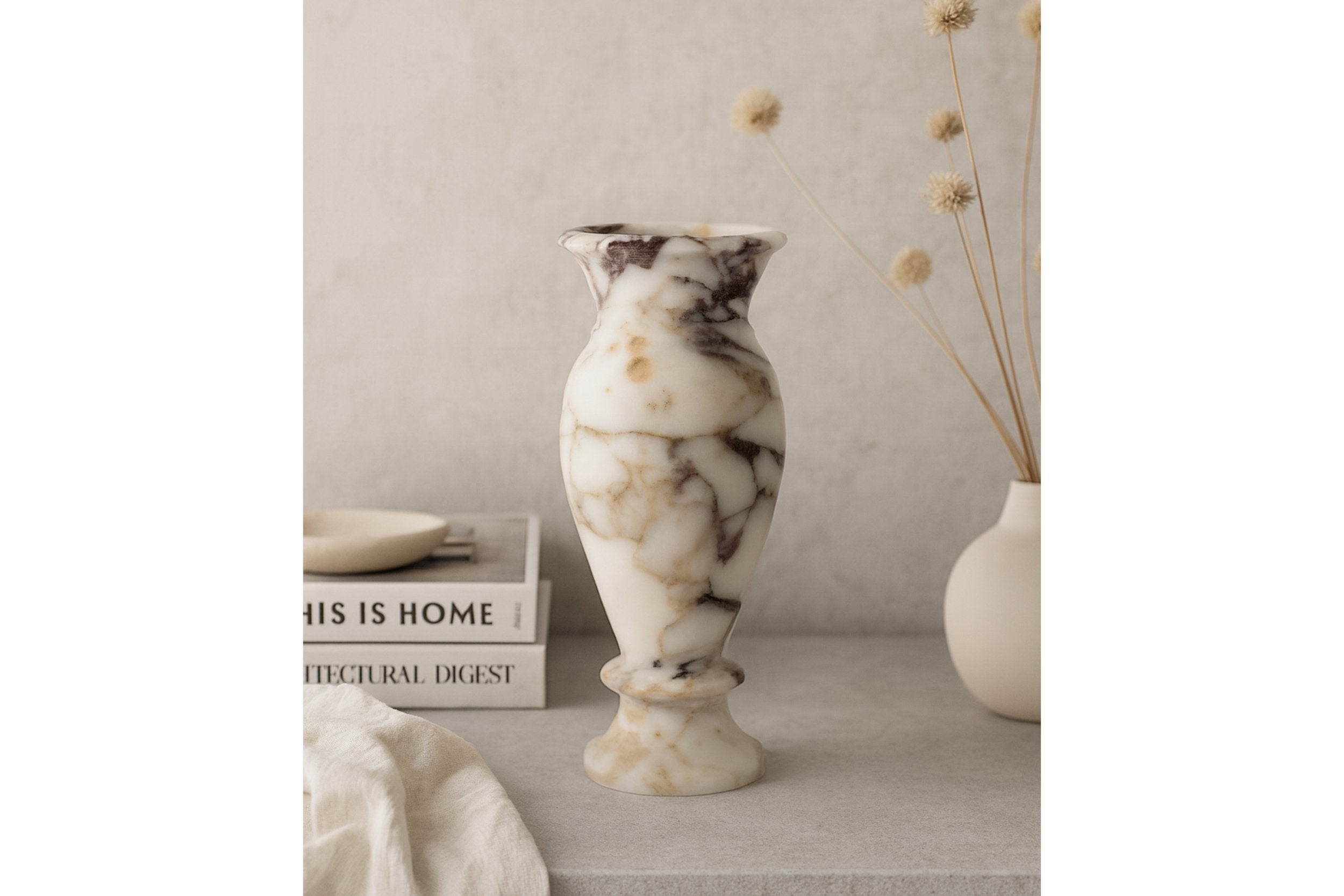 Tall marble vase with dried branches on neutral wooden shelf – Japandi inspired home decor