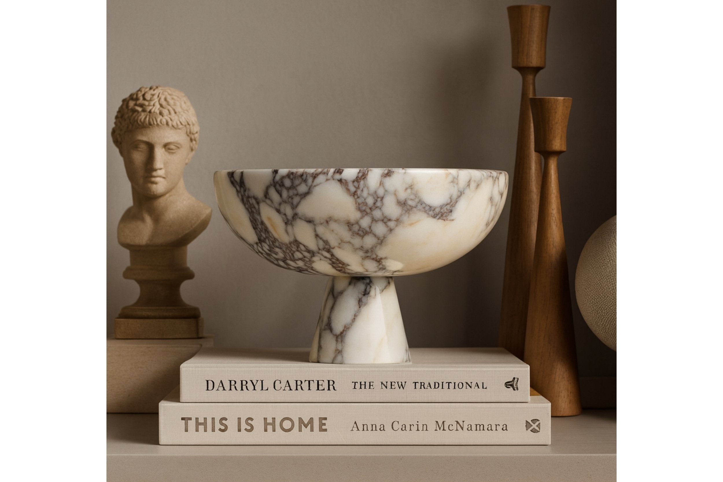marble pedestal bowl displayed on terrazzo surface with linen fabric and ceramic vase in japandi interior style
