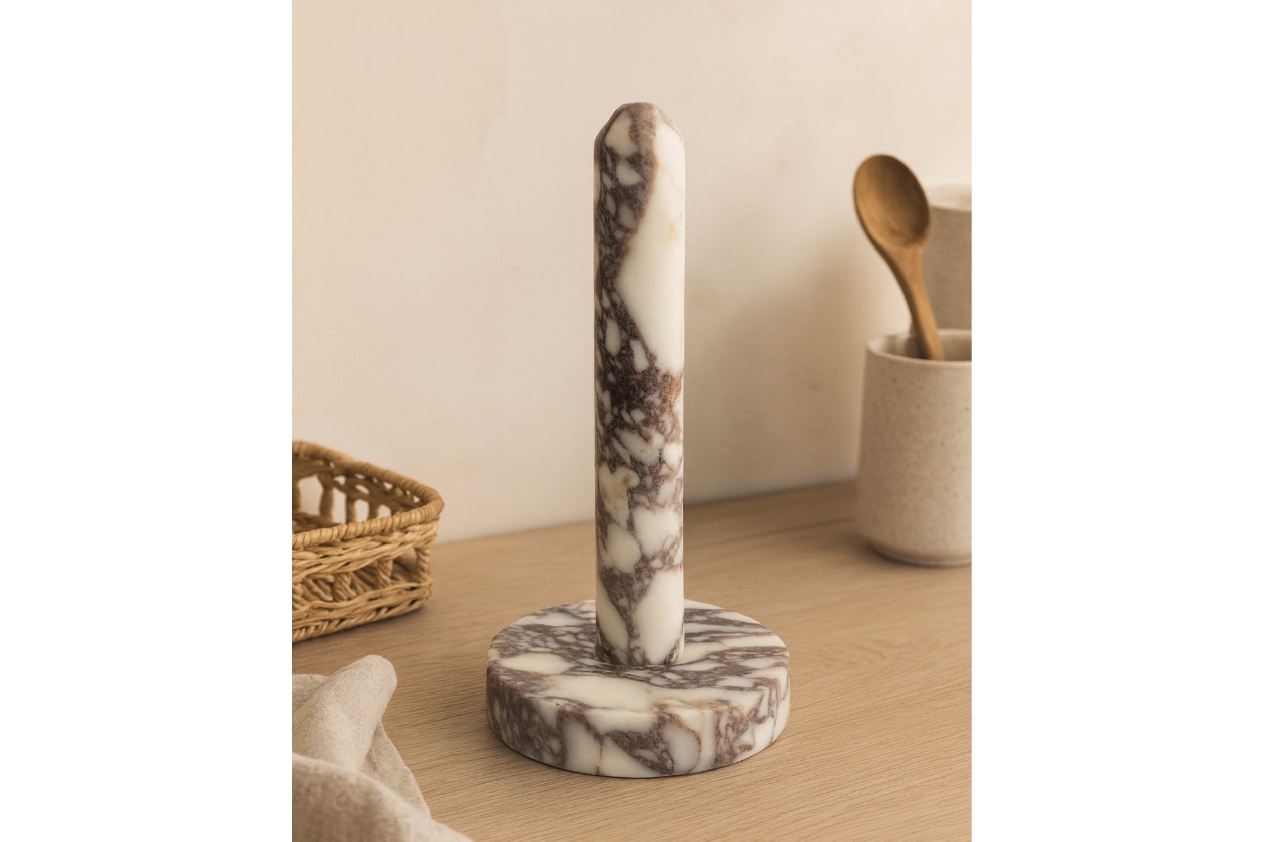 Handmade marble paper towel holder under warm natural light
