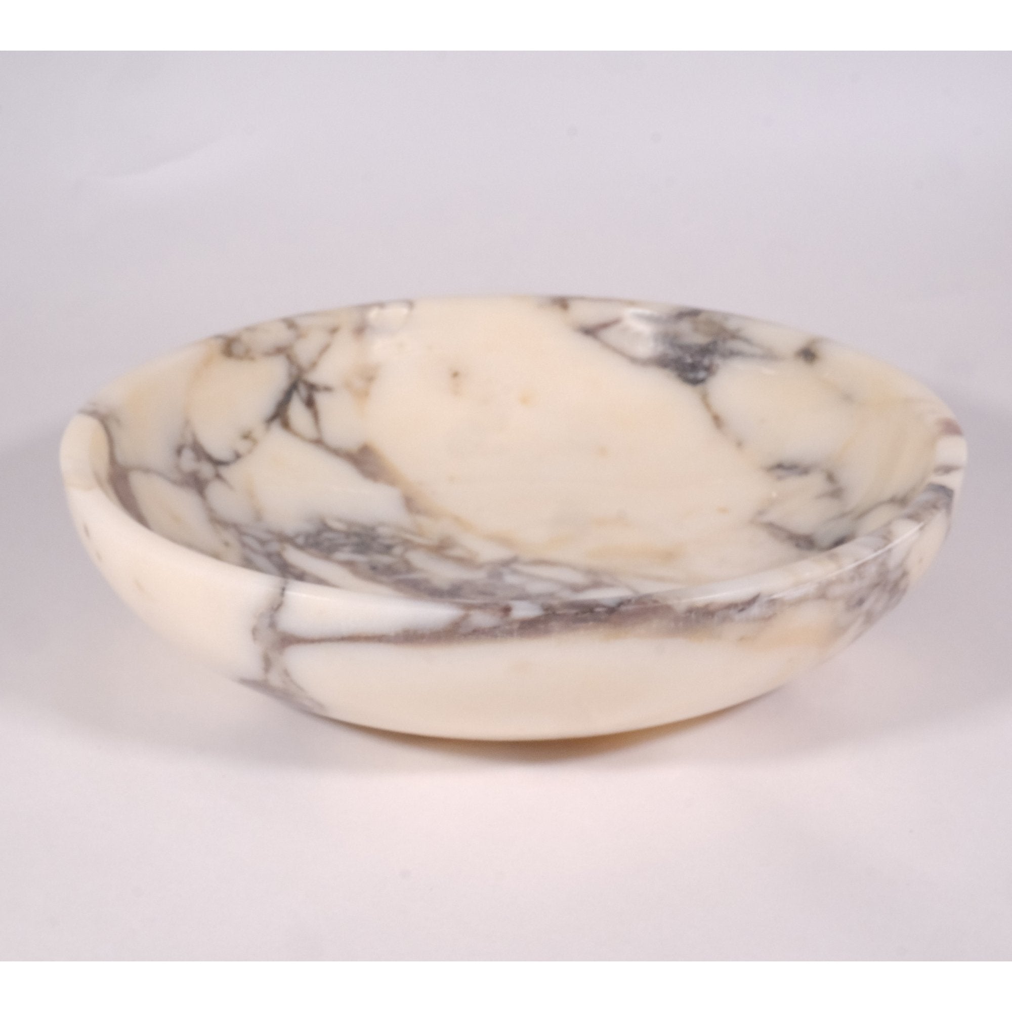 Top view of Calacatta Viola marble bowl highlighting elegant round form and natural Italian marble texture.