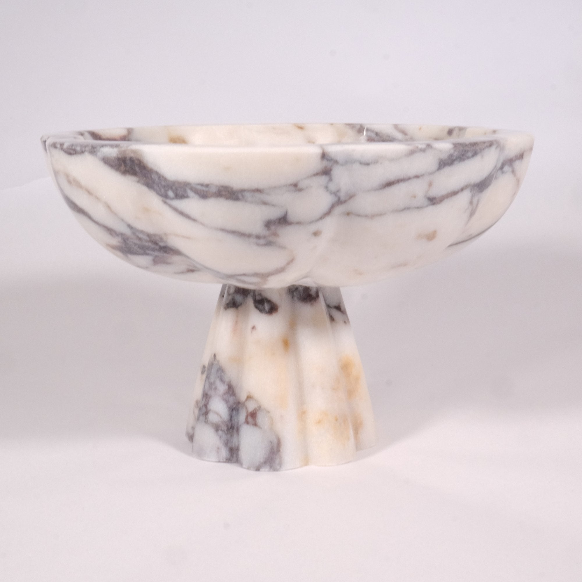 Top view of Calacatta Viola marble pedestal bowl showing natural veining — Petra Vera