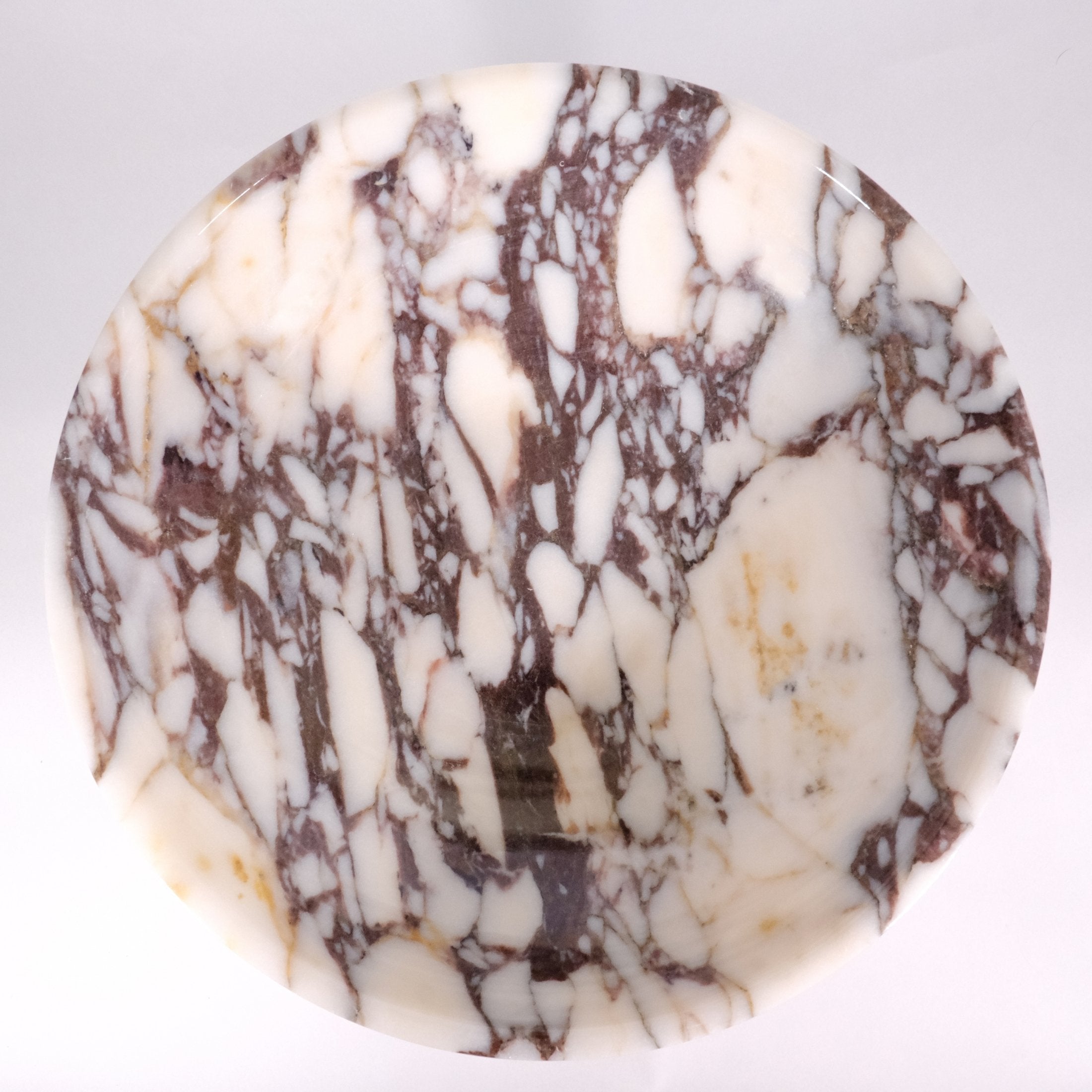 Top view of Calacatta Viola marble bowl showing organic veining and circular shape.