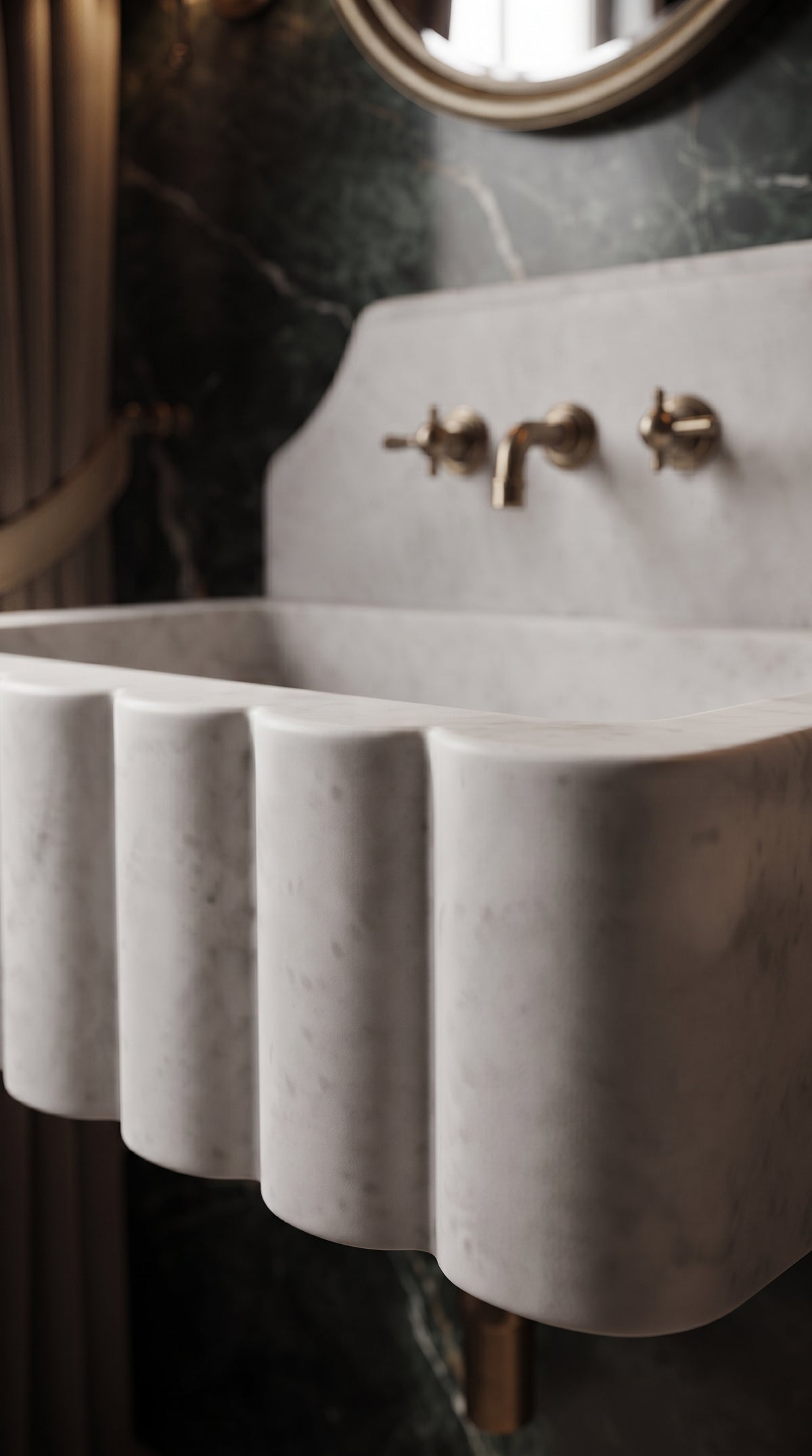 Close-up of handcrafted scalloped detailing on a Muğla White marble bathroom sink with soft grey veining and a honed matte finish.