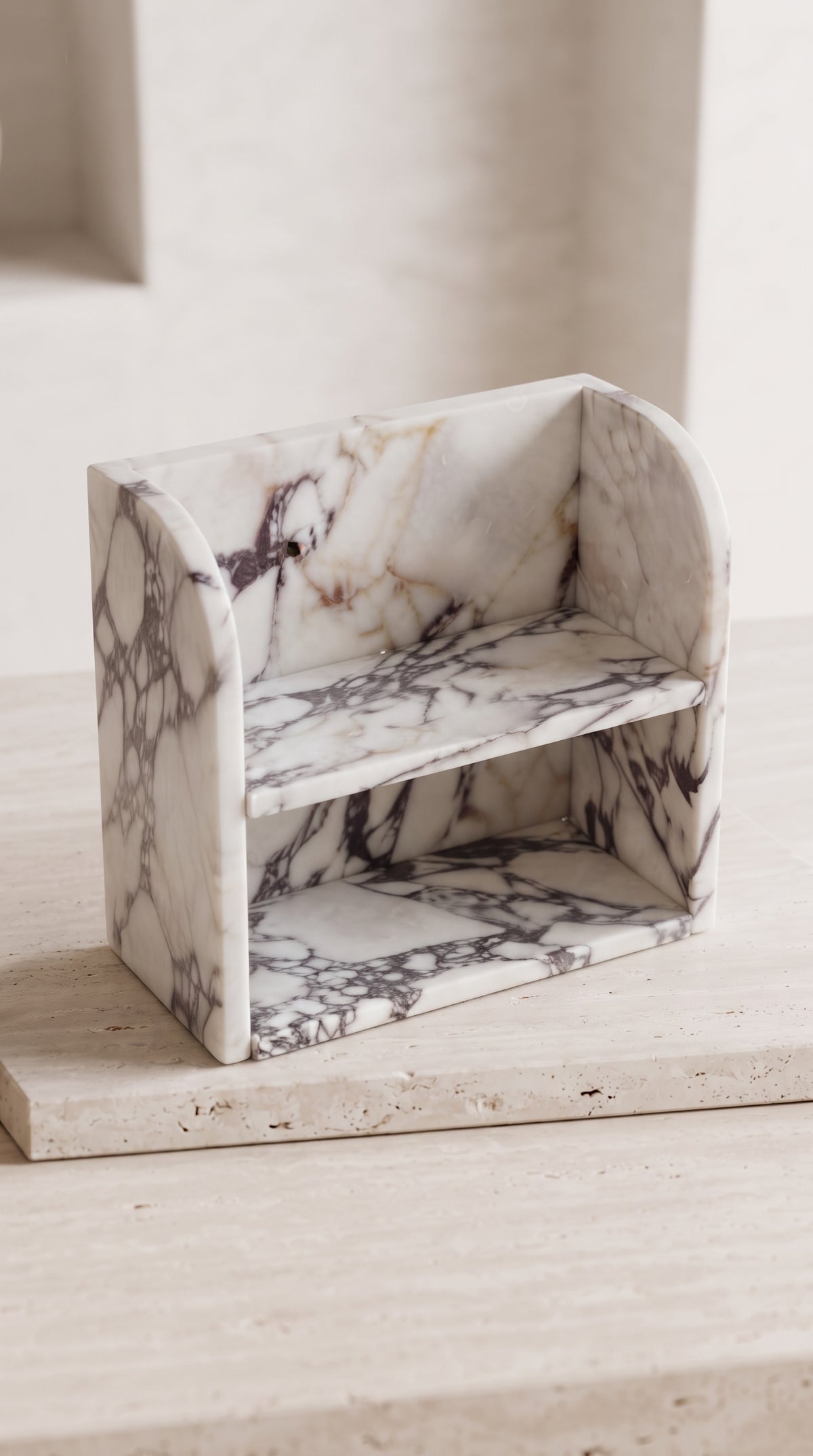 Handcrafted Calacatta Viola marble shelf showing precise 15 mm stone construction and artisan craftsmanship