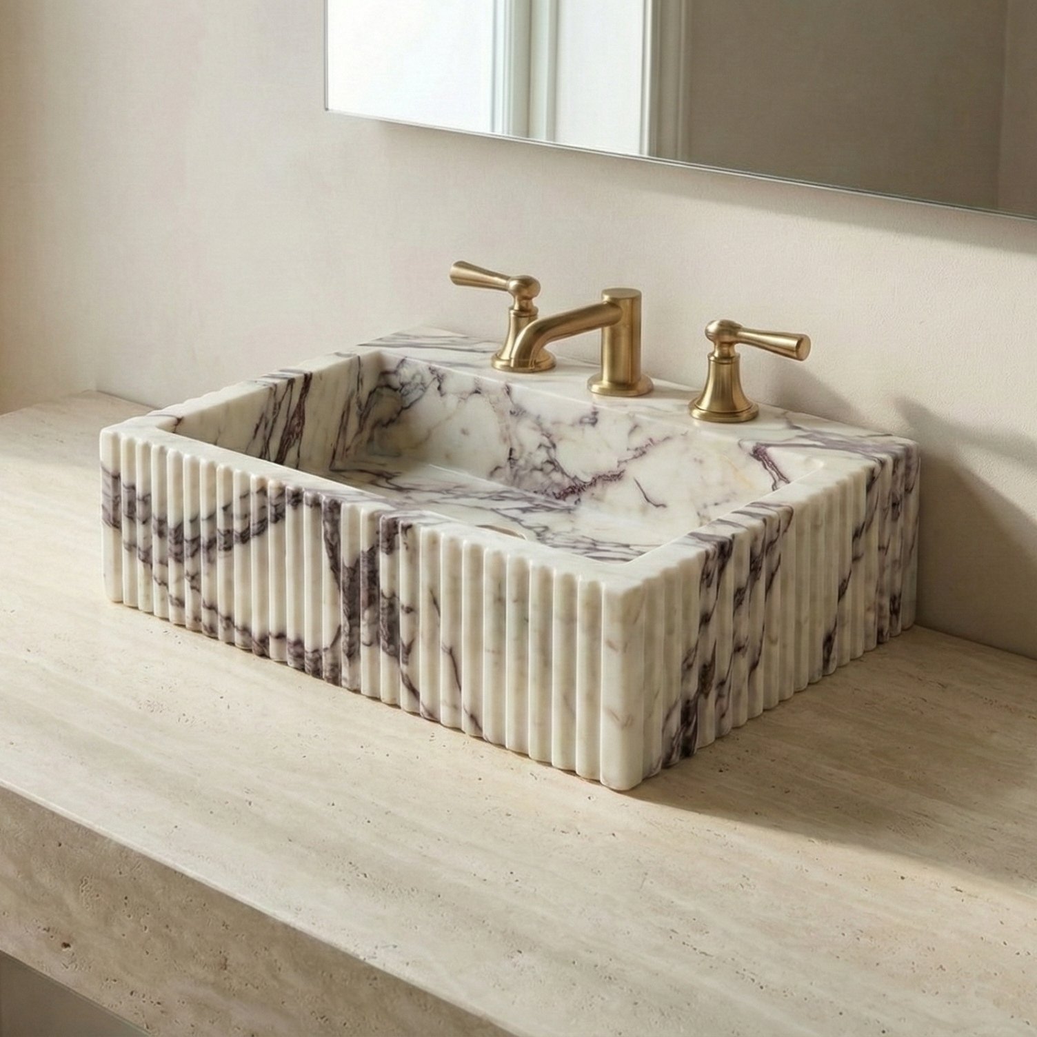Fluted Calacatta Viola marble vessel sink with rich burgundy veining on a minimalist countertop