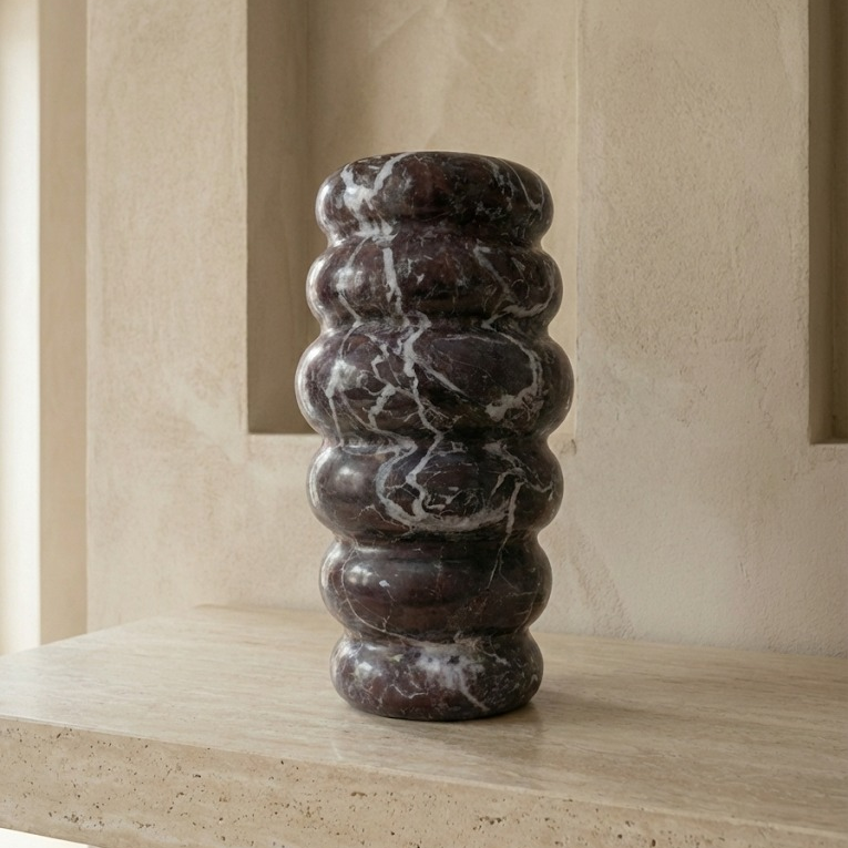 Rosso Levanto marble vase styled in modern interior as luxury decor object
