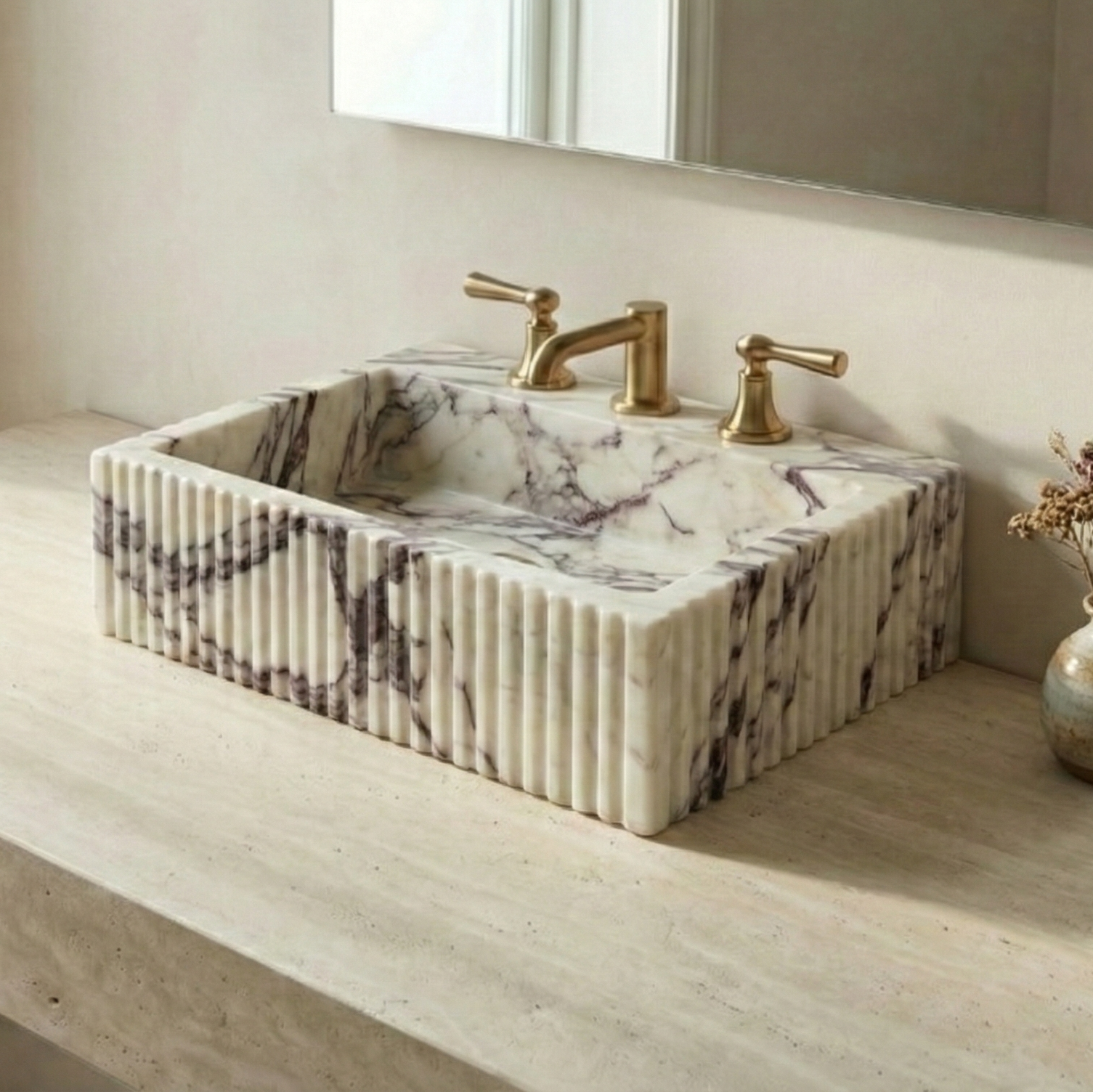 Fluted Calacatta Viola marble sink styled in a modern luxury bathroom interior