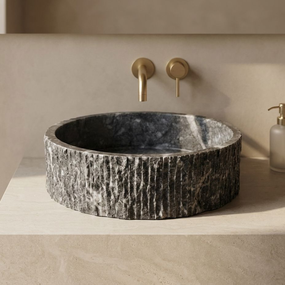 Dark grey marble fluted vessel sink styled on natural stone bathroom countertop