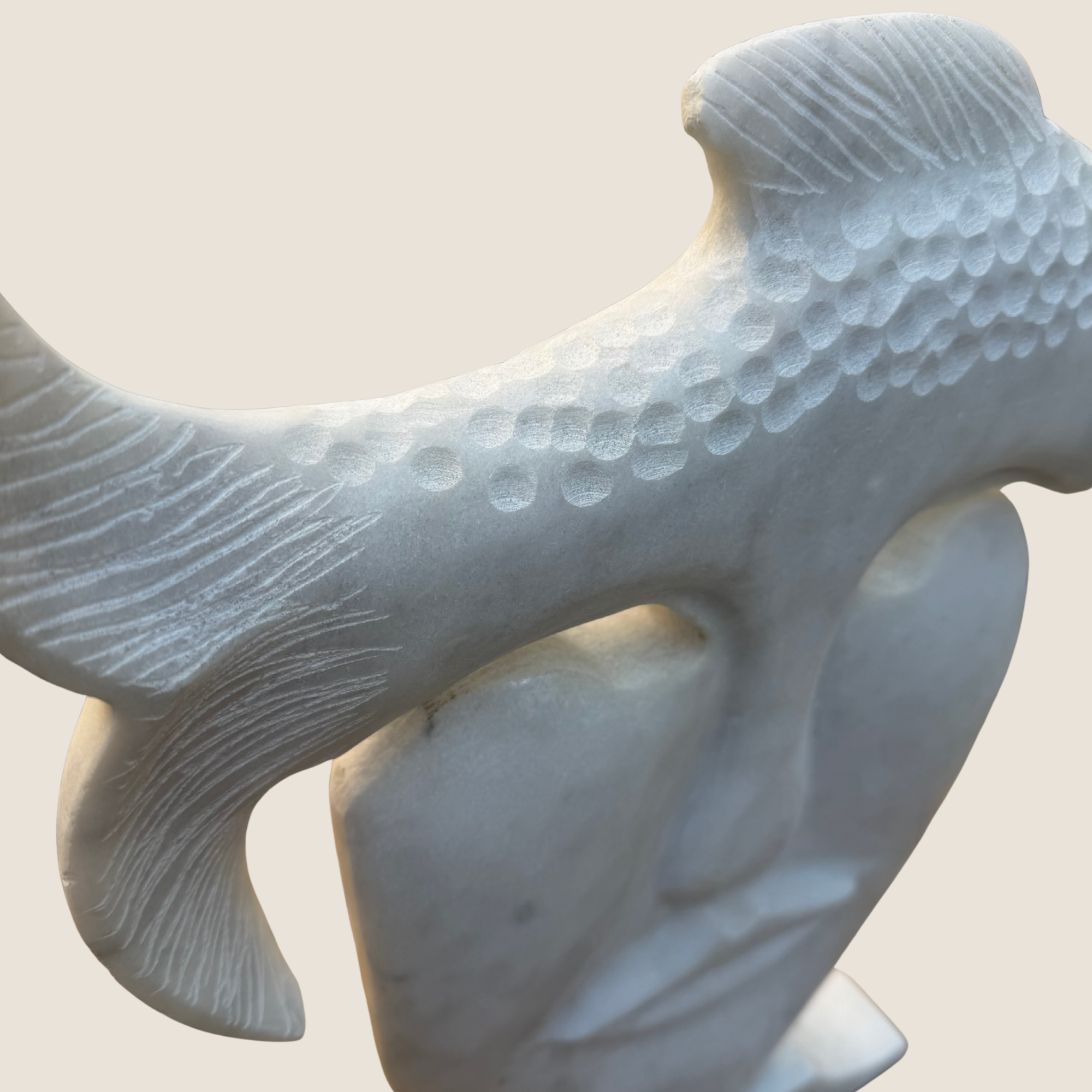 detailed side view marble sculpture fish element close up