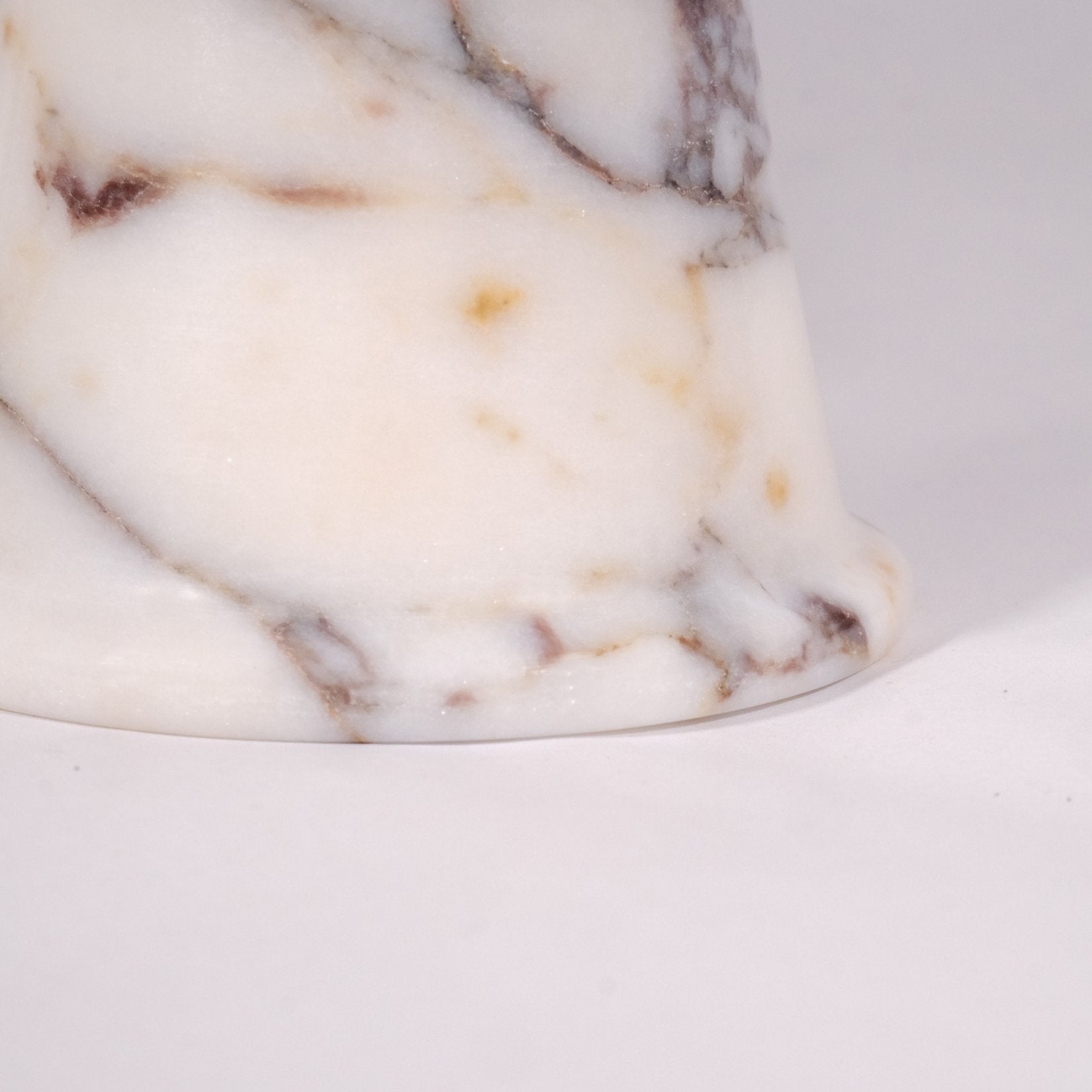Detailed close-up of Calacatta Viola marble bowl highlighting natural stone texture.