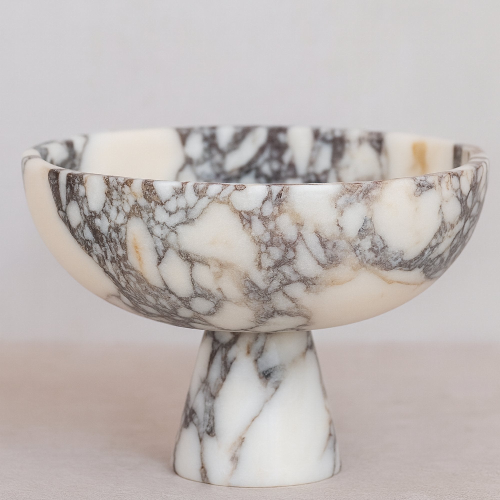 calacatta viola marble pedestal bowl on white background, handmade italian marble centerpiece with polished finish