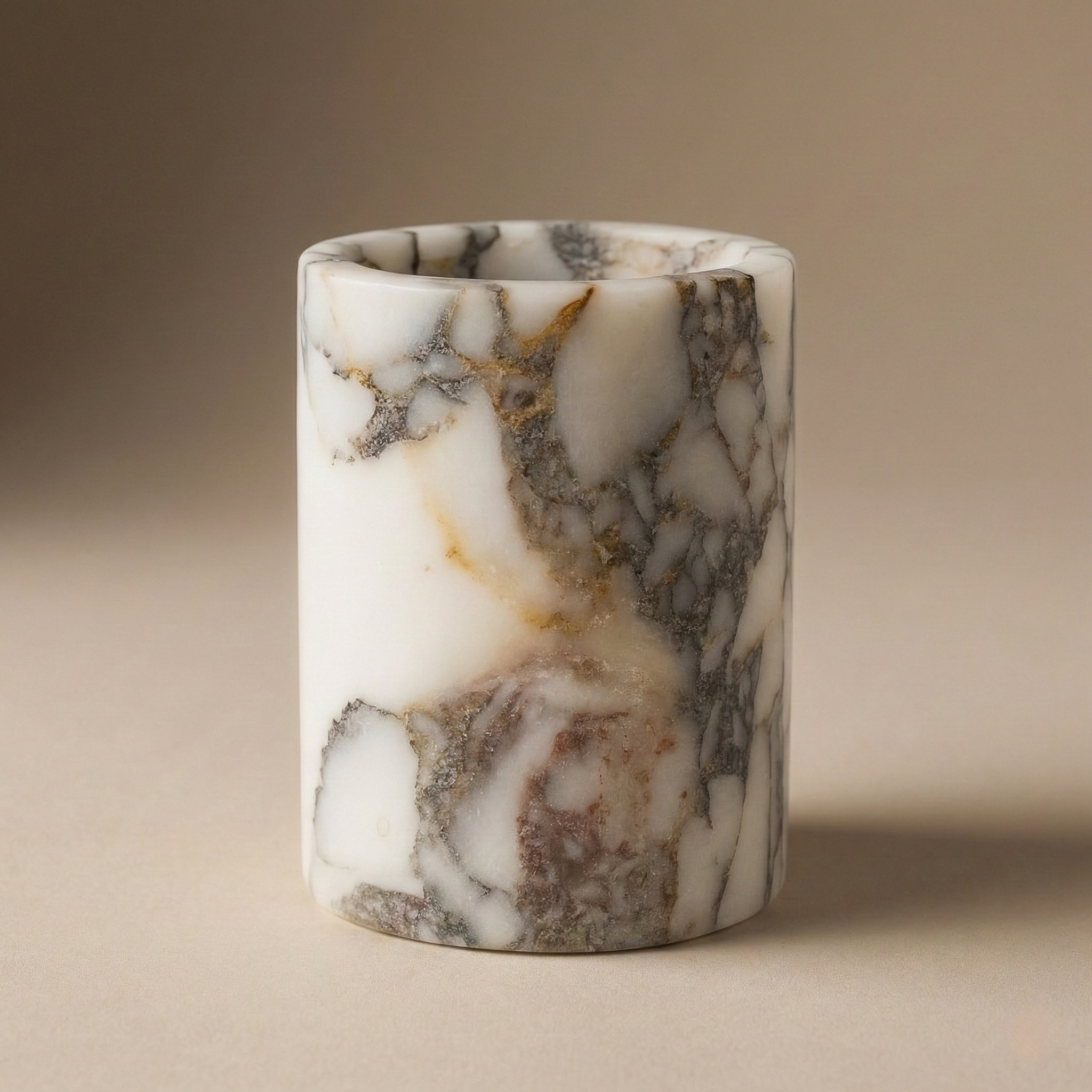 Handcrafted Calacatta Viola marble pen holder on white background – elegant veining, smooth polished surface, minimalist luxury style.