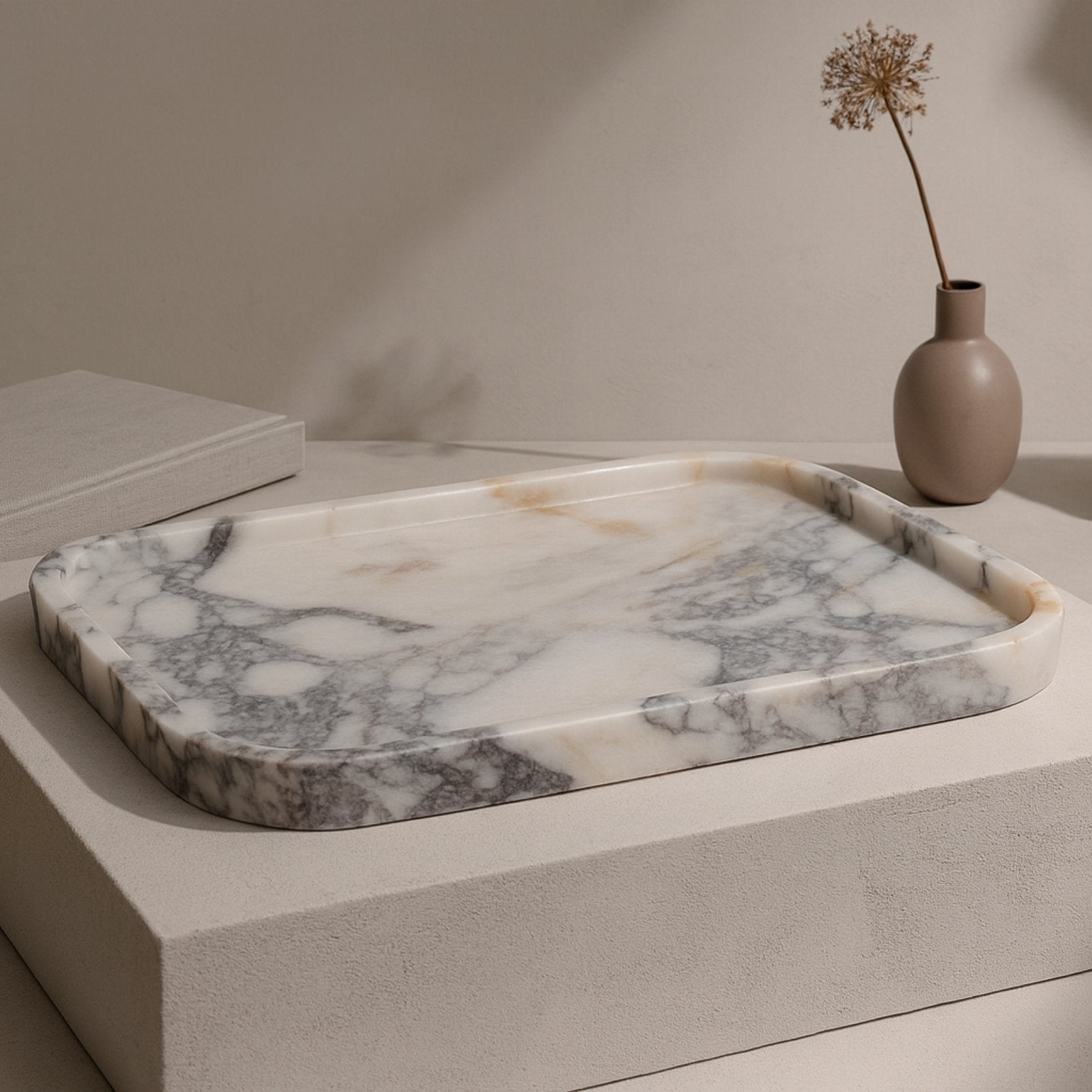 Calacatta Viola marble tray styled in a minimal Japandi-inspired setting with neutral decor elements
