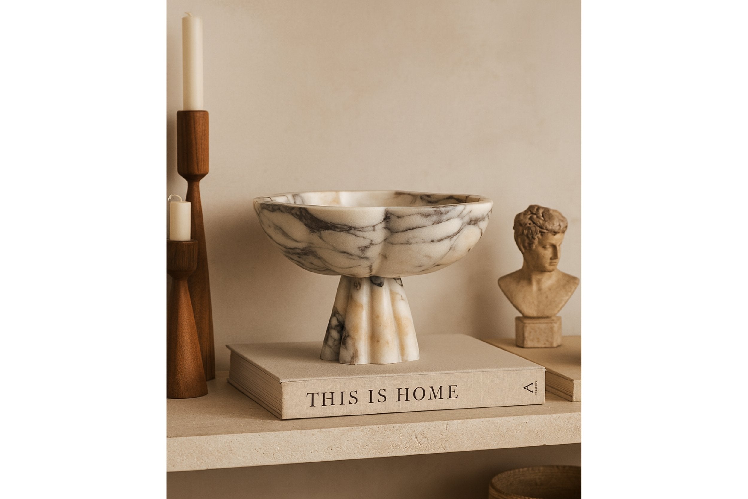 Calacatta Viola marble bowl displayed on “This Is Home” book — Petra Vera
