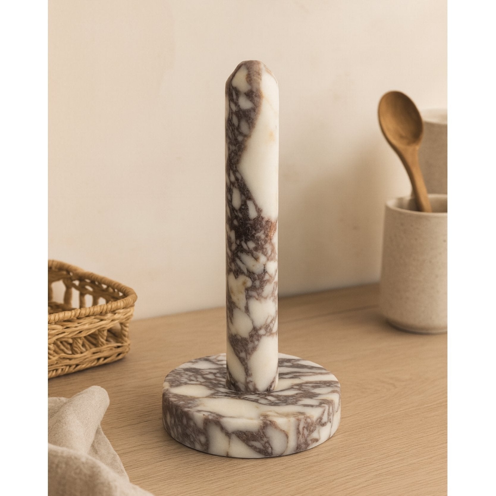 Handmade marble paper towel holder under warm natural light
