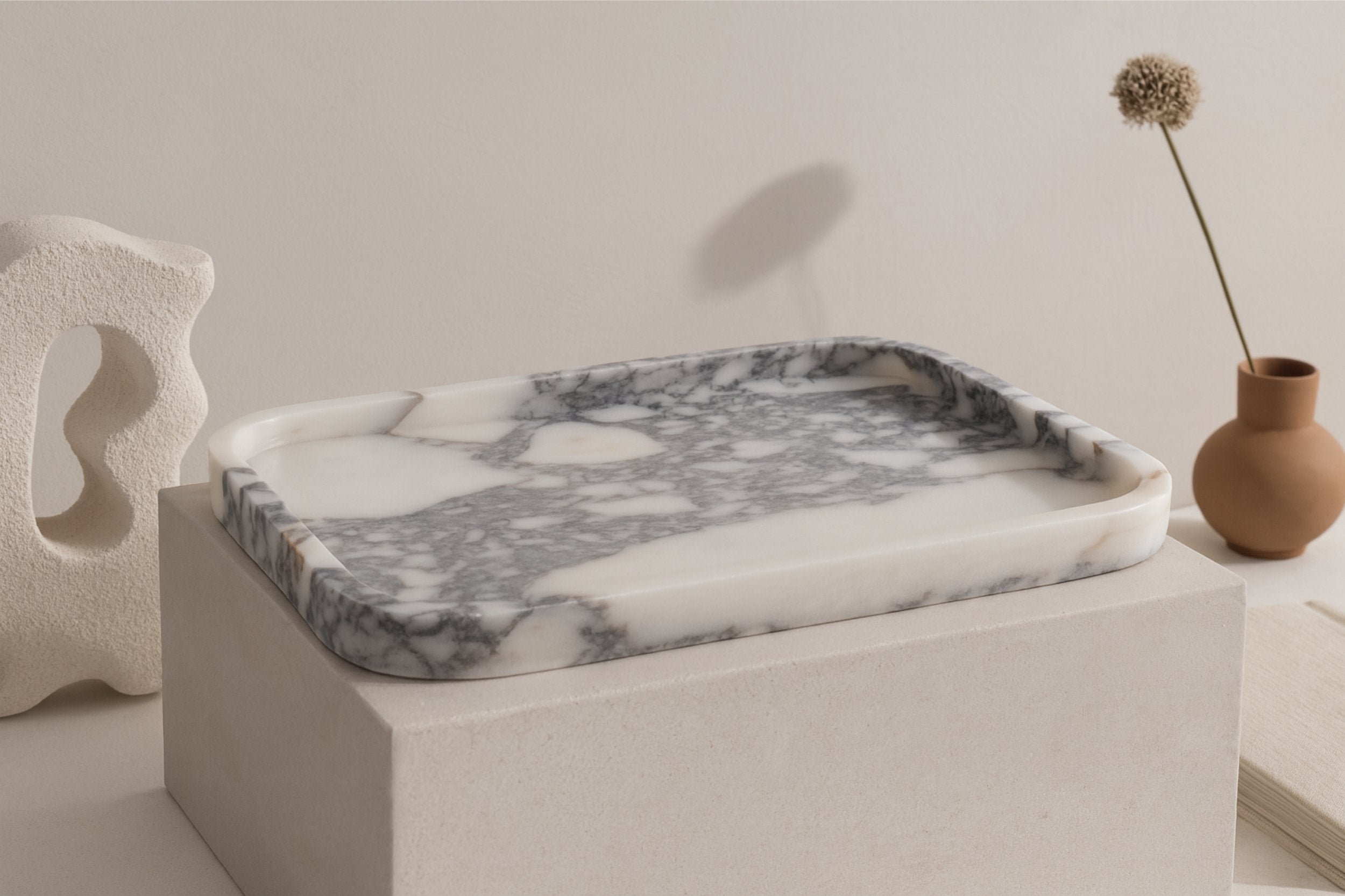 Calacatta Viola marble tray displayed in a neutral gallery-inspired setting with soft shadows.