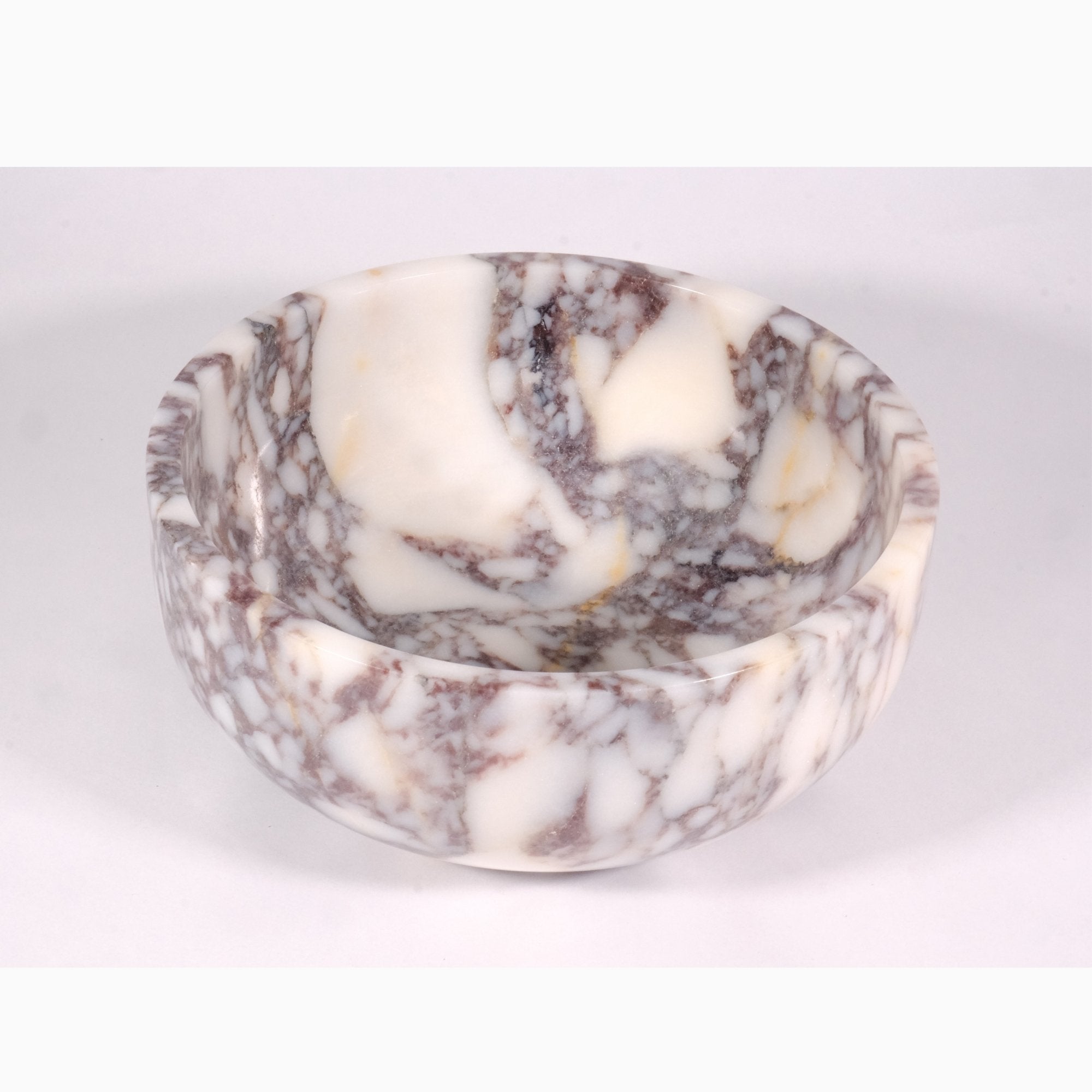 Top view of Calacatta Viola marble bowl revealing inner veining pattern and handcrafted details.