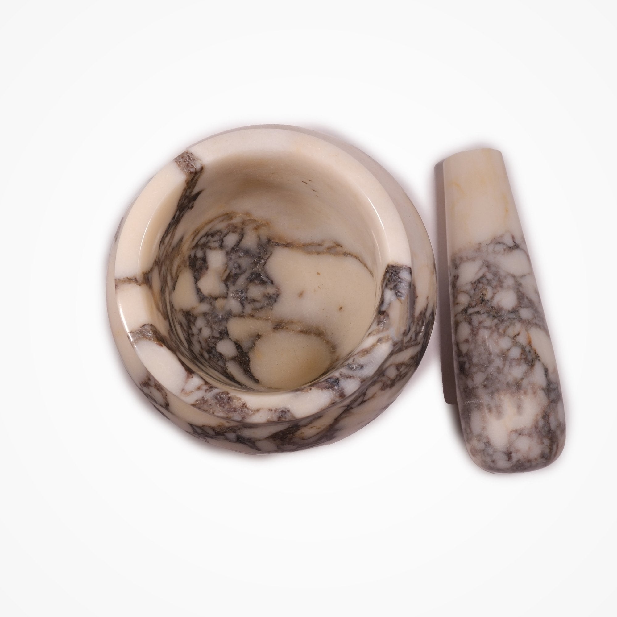 Top view of Calacatta Viola marble mortar and pestle, handcrafted design with natural veining, Petra Vera kitchen collection.