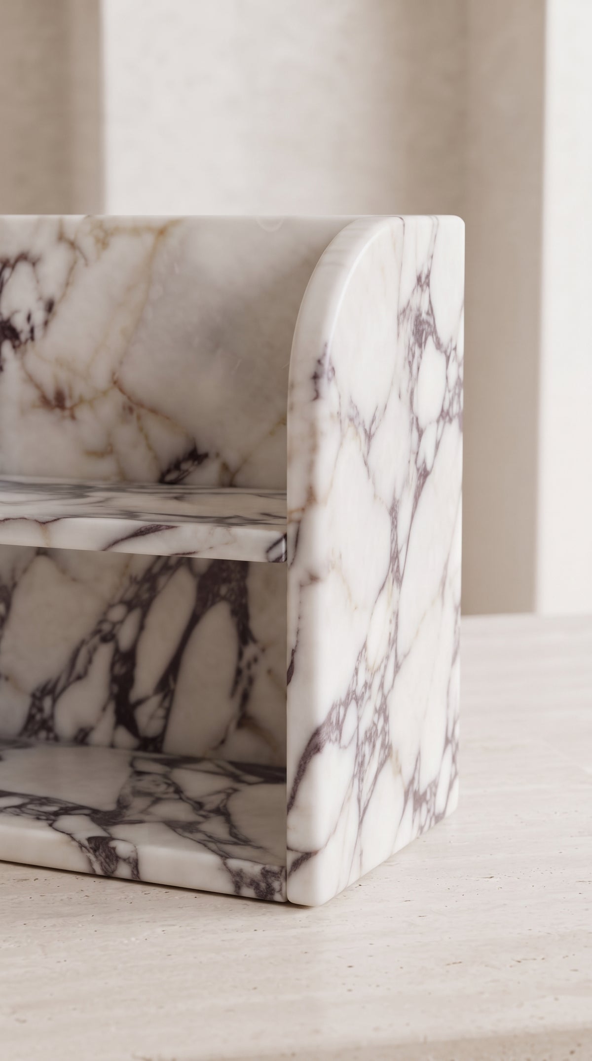 Close-up of Calacatta Viola marble organizer showing slim stone edges, natural veining and handcrafted finish
