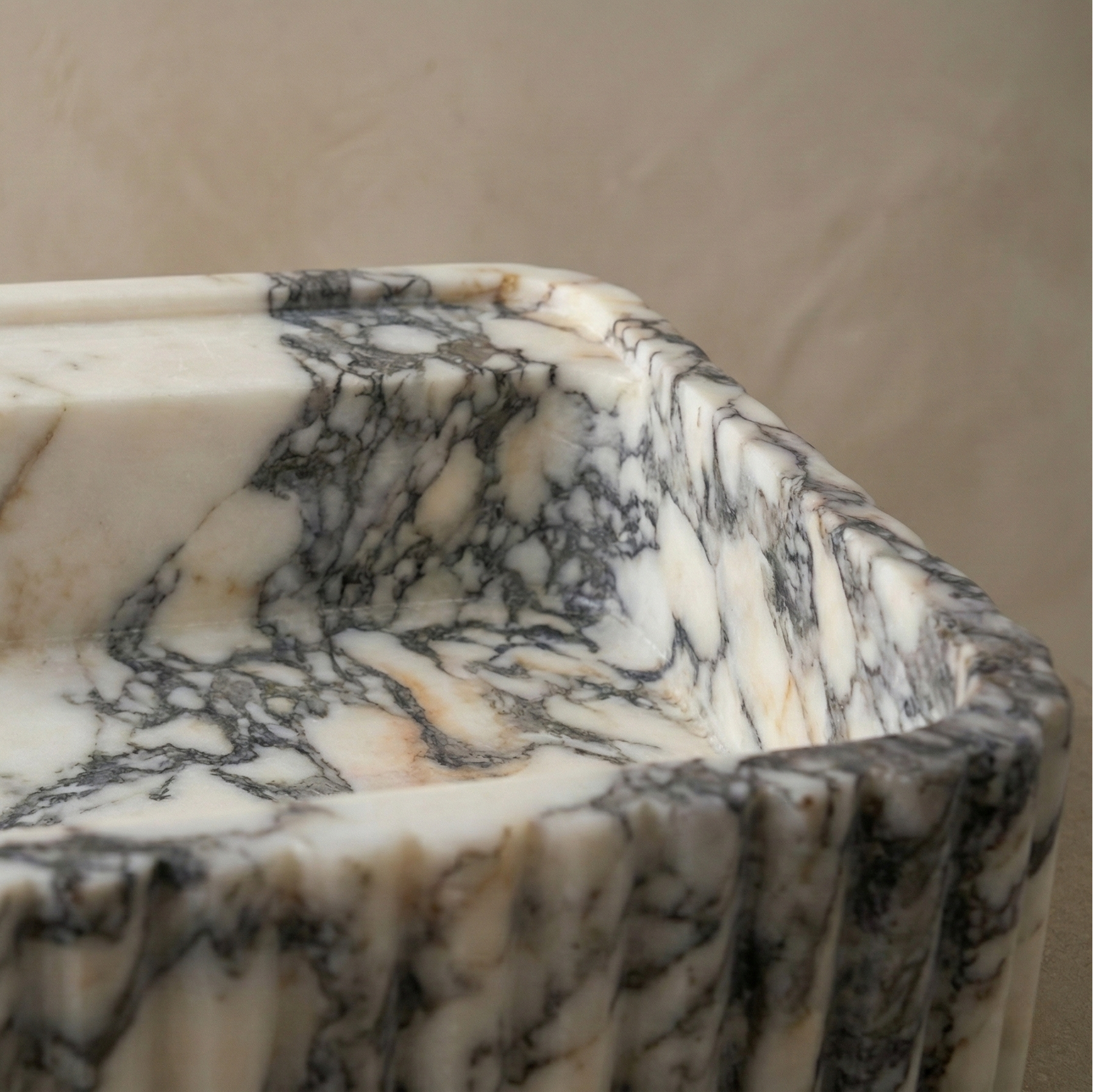 calacatta viola marble sink close up burgundy veining natural stone detail