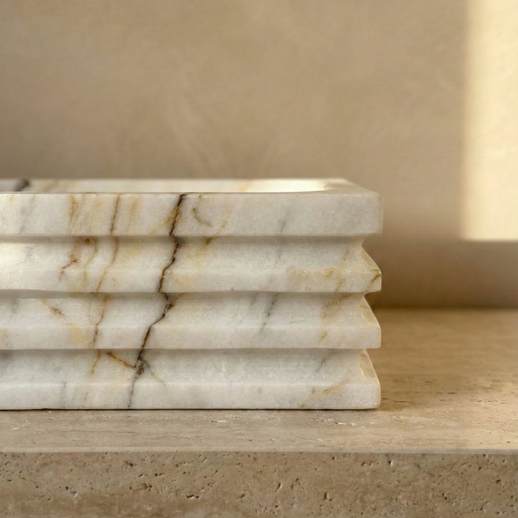 close up lilac marble sink gold veining detail natural stone vessel basin texture