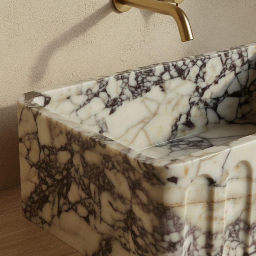 Close up detail of fluted Calacatta Viola marble sink showing natural stone texture