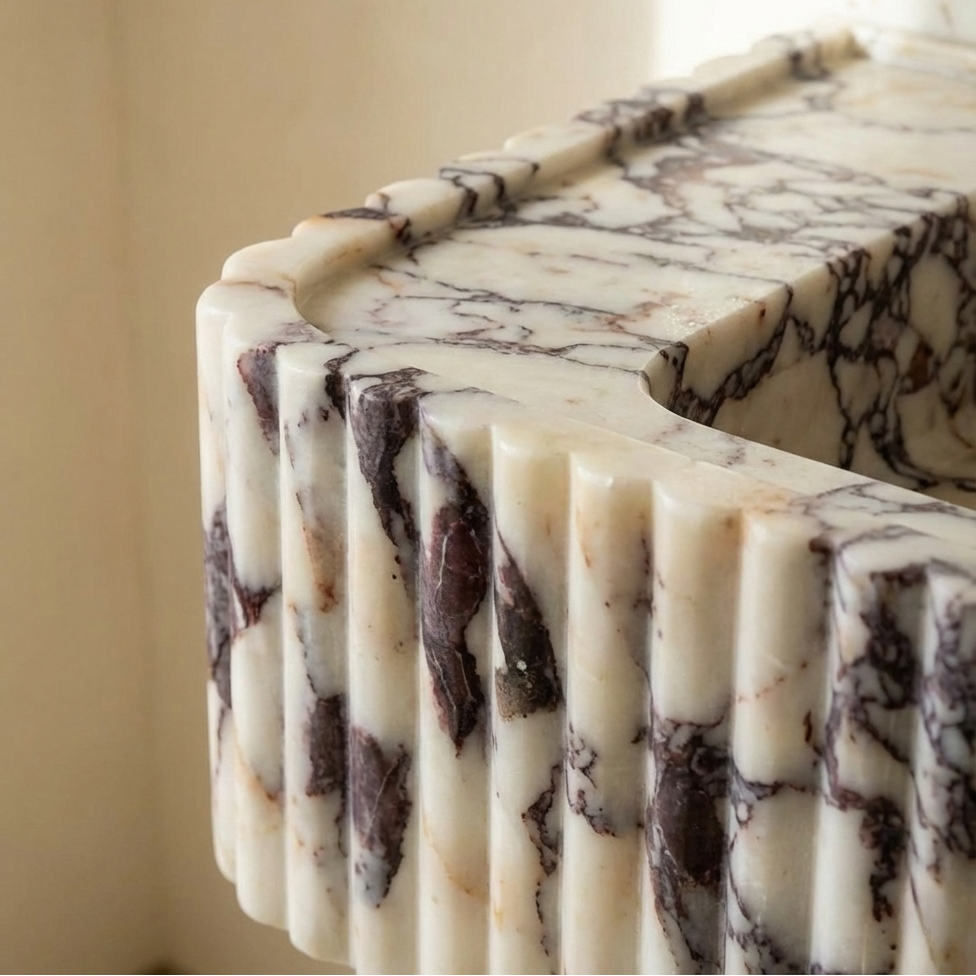 Close-up fluted marble sink texture detail natural stone vessel basin luxury bathroom
