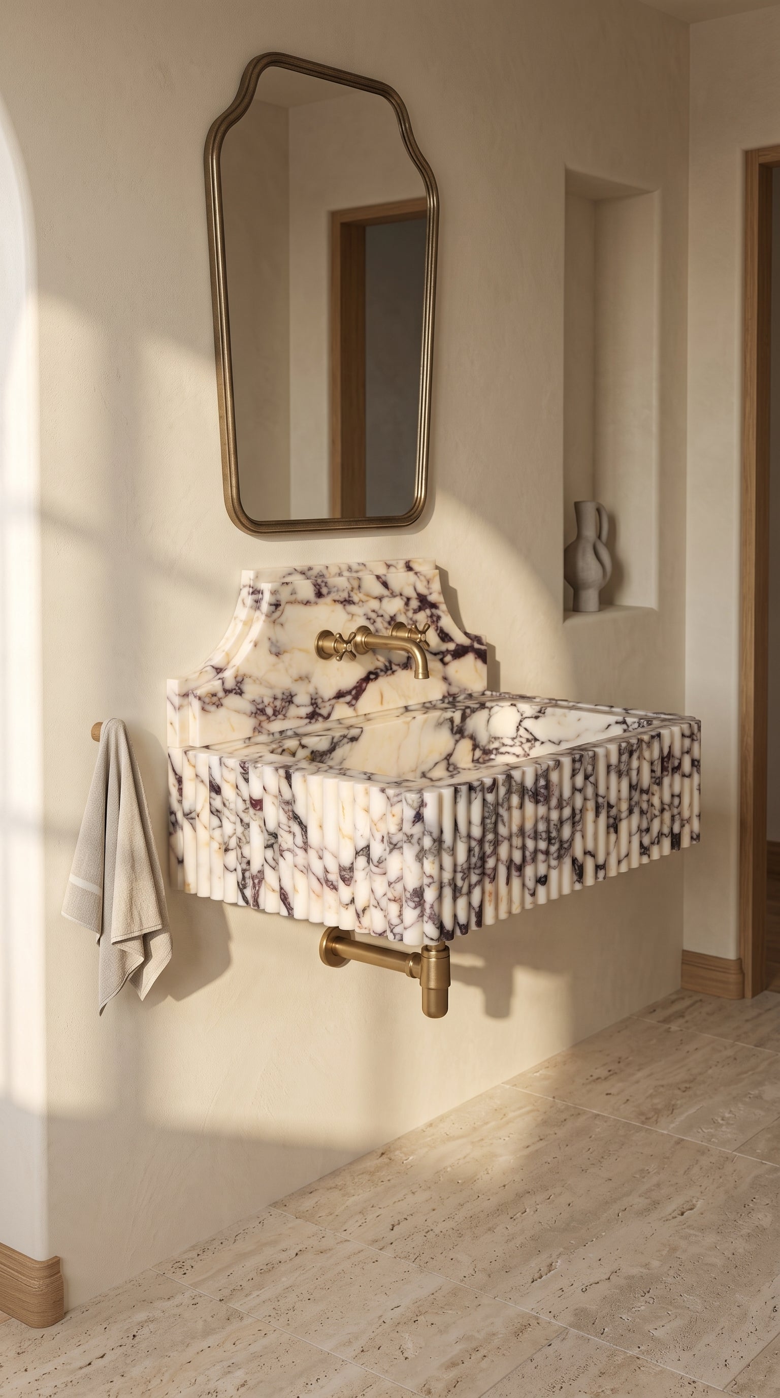 Wall-mounted Calacatta Viola marble washbasin displayed in a bright minimalist bathroom with warm natural light.