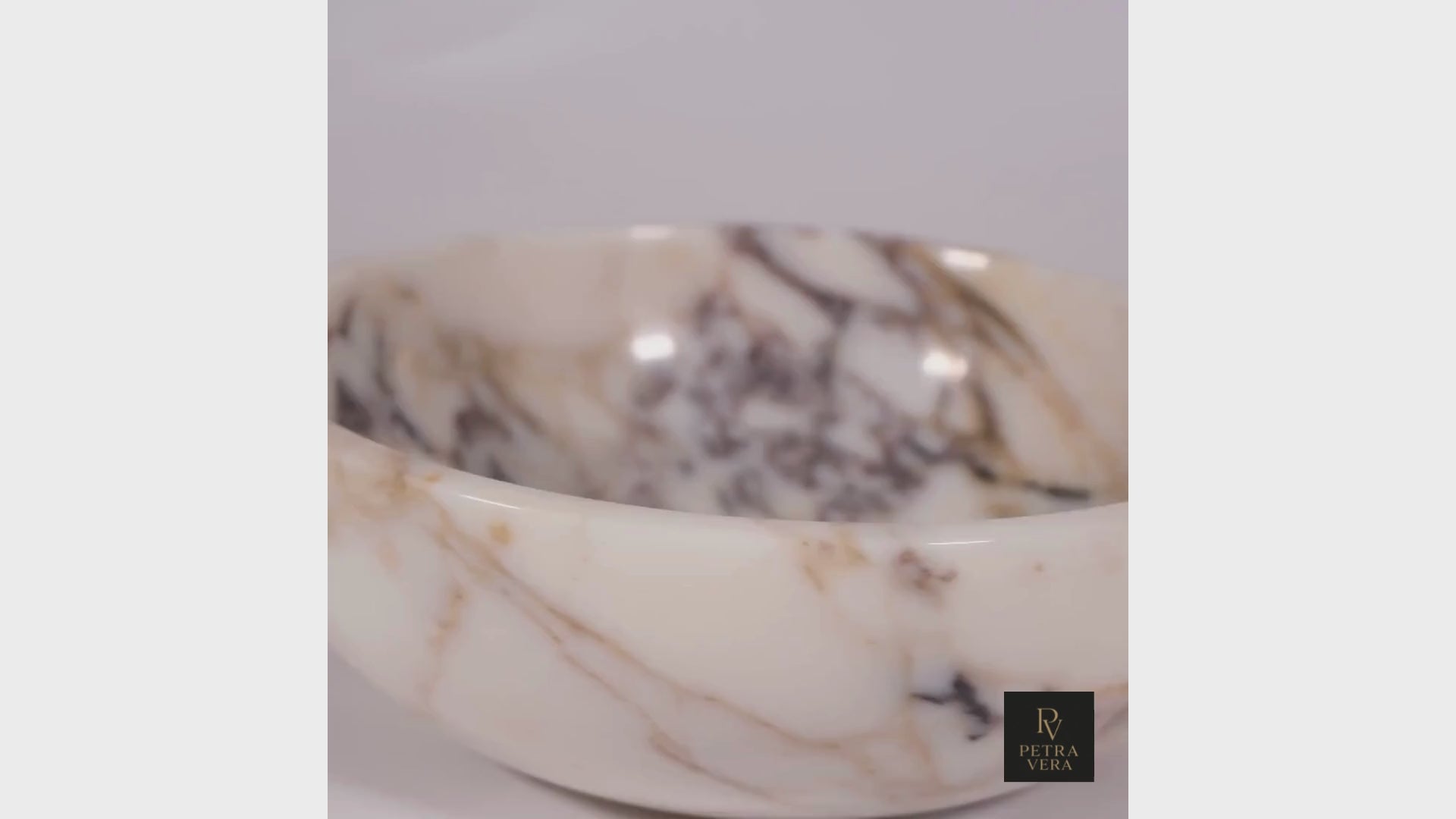 Rotating view of Calacatta Viola marble bowl showing texture, color veins, and elegant craftsmanship in high definition.