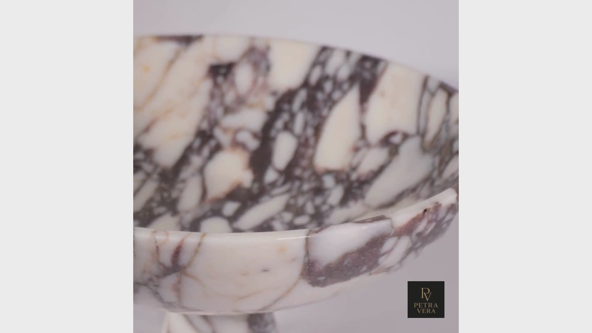 Short product video showing Calacatta Viola marble bowl with soft lighting and detail view.
