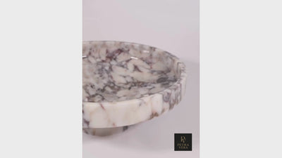 360-degree rotating view of the Calacatta Viola marble pedestal bowl showing its craftsmanship and natural veining.