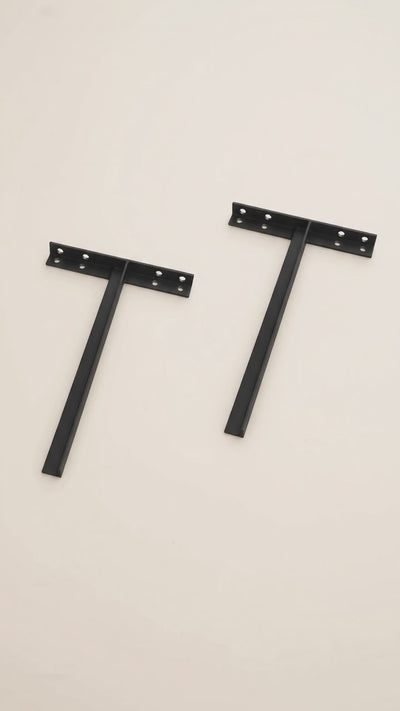 Product slideshow showing a pair of black metal T-shaped sink brackets, a welded joint close-up, and a full view of one bracket.