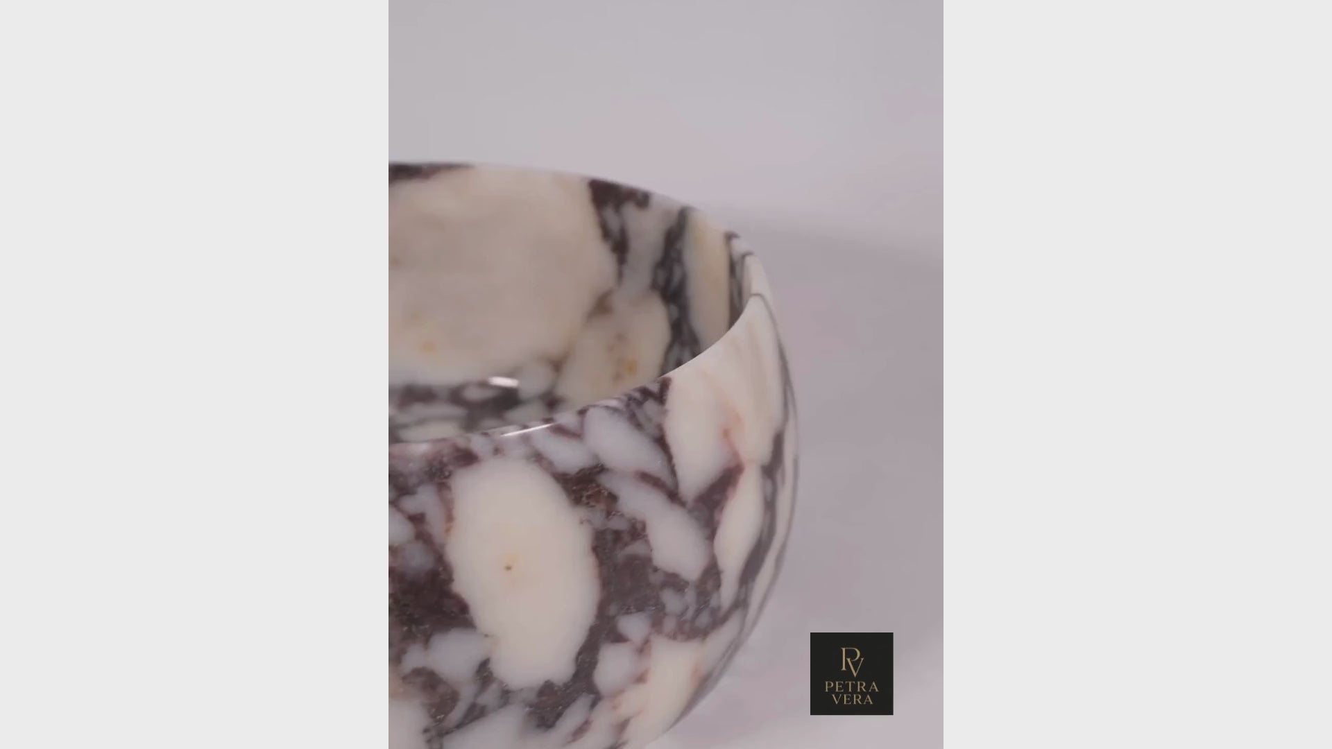 Video: 360° view of Calacatta Viola marble pedestal bowl, polished finish and veins.