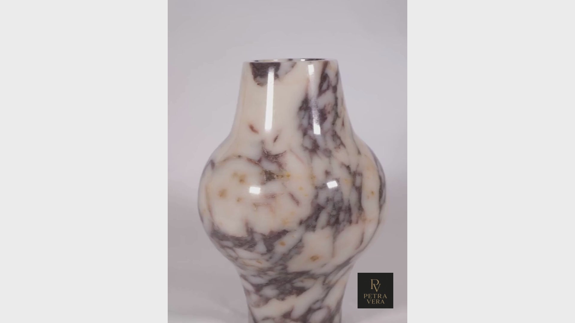 360° view of Modern Calacatta Viola marble decorative vase highlighting its curves, polished finish, and violet veining.