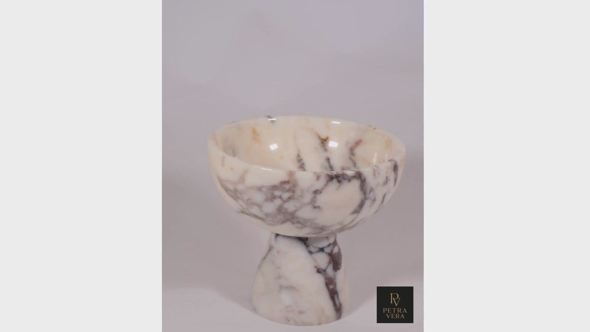 360° rotating video of Calacatta Viola marble pedestal bowl, showcasing the natural veining, smooth finish, and elegant handcrafted design.