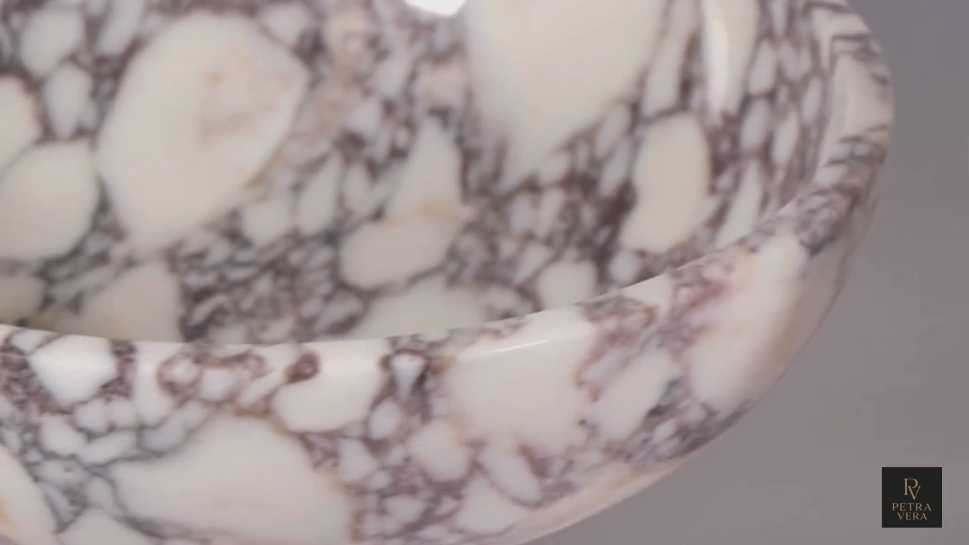 Video showing the real texture and proportions of a handmade Calacatta Viola marble pedestal bowl